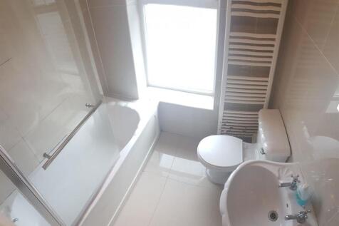A clean and well-maintained bathroom featuring ...