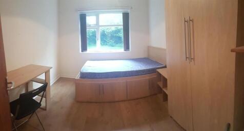 A compact bathroom featuring a WC, with clean a...