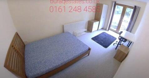 A small, tidy single toilet with a clean toilet...