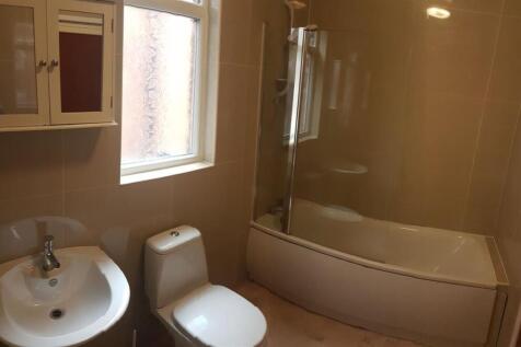 A clean and well-maintained bathroom featuring ...