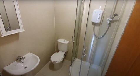 A clean and modern bathroom suite featuring a s...