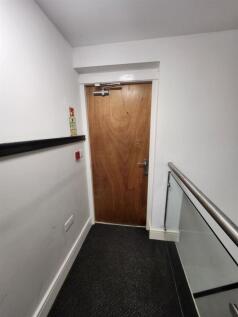 A clear view of the entrance door to the proper...