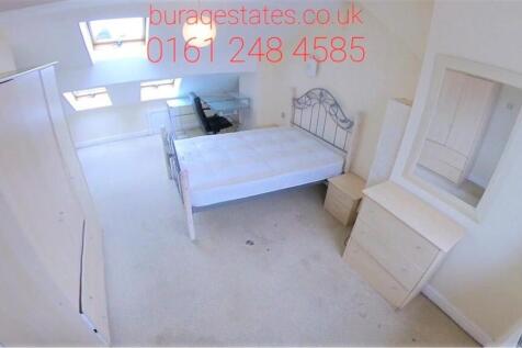 A bright and tidy single bedroom featuring a be...