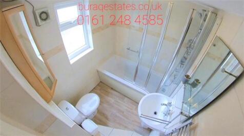 A clean and well-maintained bathroom with a spa...