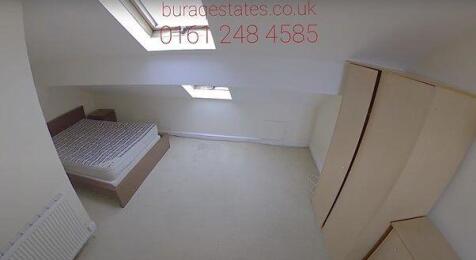 A clean and simple single bedroom featuring a b...