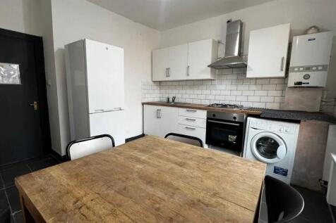 Bright and modern kitchen featuring ample stora...