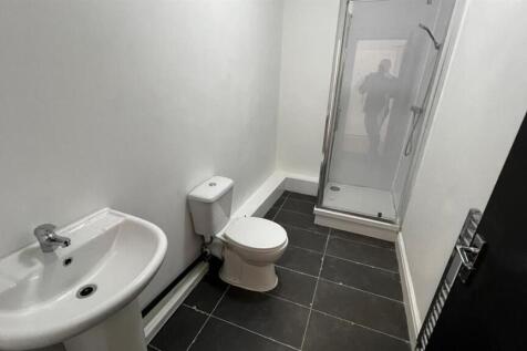 Bright and clean bathroom featuring a modern si...