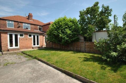 A well-maintained private garden featuring a sp...