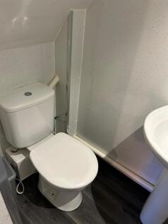 A clean and well-maintained single toilet area ...