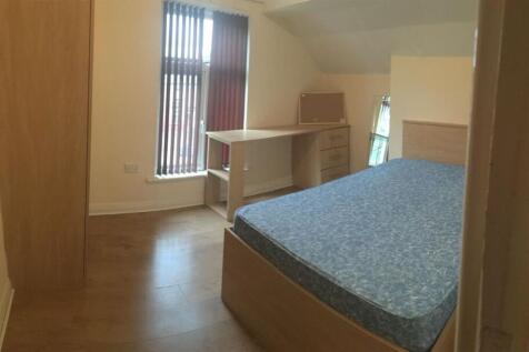 Bright furnished bedroom with a double bed, bui...