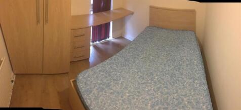 Neat single bedroom with a bed, fitted wardrobe...