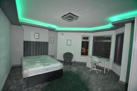 Spacious, recently updated bedroom with a plush...