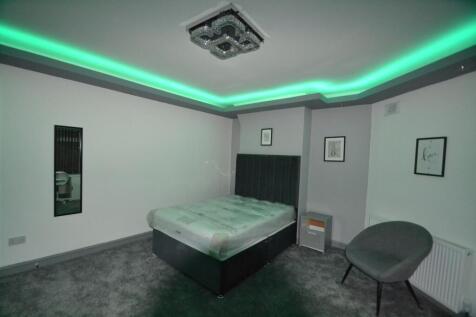 Stylish double bedroom with contemporary recess...