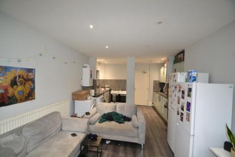 A cozy kitchen area with modern appliances, per...