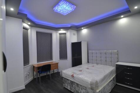 Modern double bedroom with feature LED cove lig...