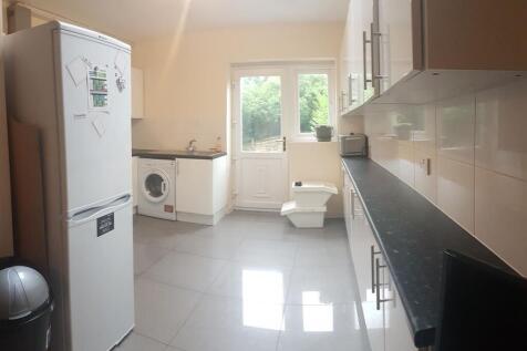 Bright modern kitchen with glossy tiled floor, ...