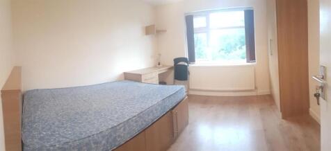 Bright, tidy bedroom with a built-in bed frame,...