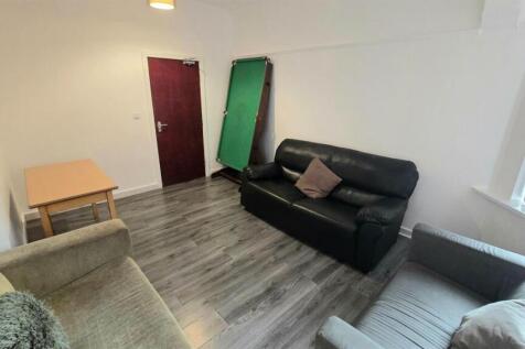 Bright, modern living room with laminate floori...