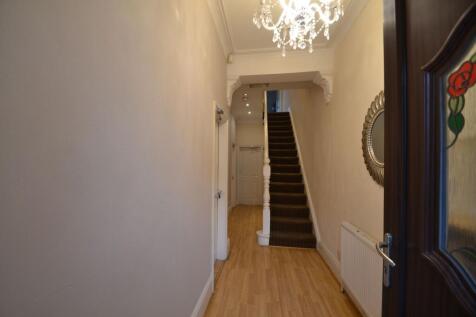 The property features an inviting entrance hall...