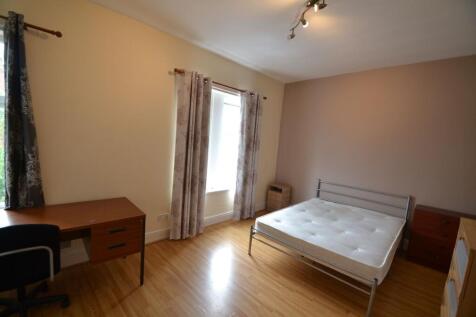 Bright and inviting bedroom featuring a comfort...