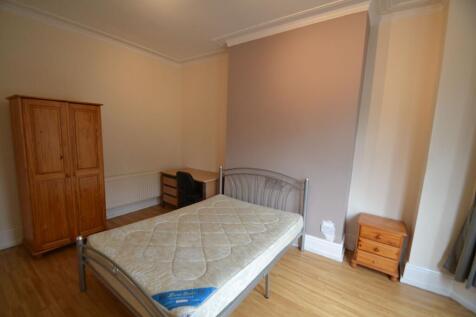 A neatly maintained single bedroom featuring a ...