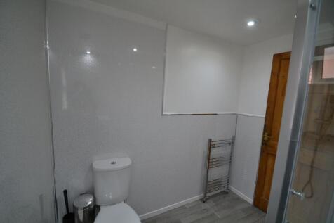 Clean and modern bathroom featuring a toilet, w...