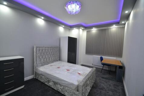 Modern master bedroom featuring a plush, elegan...