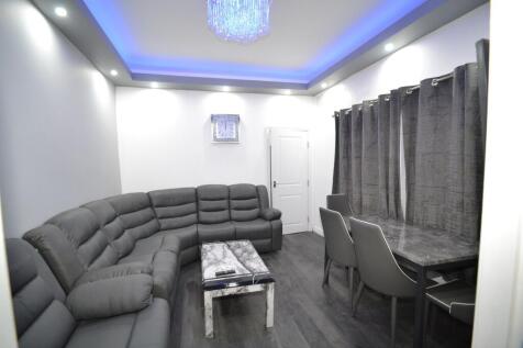 Modern and spacious living room featuring a lar...