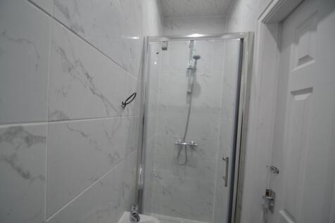 A clean, modern bathroom featuring a white marb...