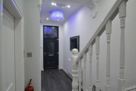 The entrance hall of the property features a mo...