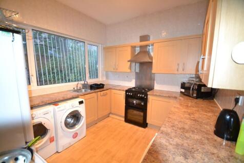 Bright and functional kitchen with ample counte...