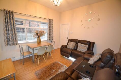 A cozy and well-maintained living room with com...