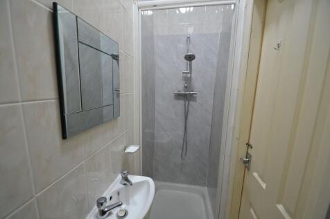 A clean, well-maintained bathroom with a modern...