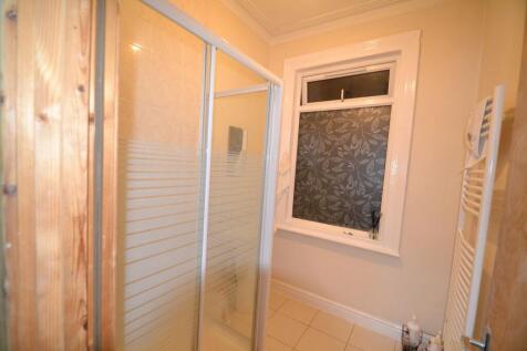 A clean, well-maintained bathroom featuring a s...