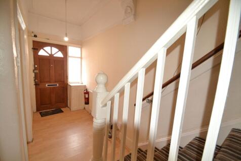 Bright, welcoming entrance hall with a solid wo...