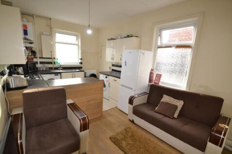 Well-equipped open-plan living area with a comp...