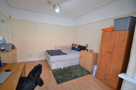 Bright furnished bedroom with a double bed, mat...