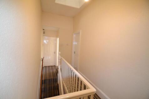 Bright, neutrally painted landing and stairwell...