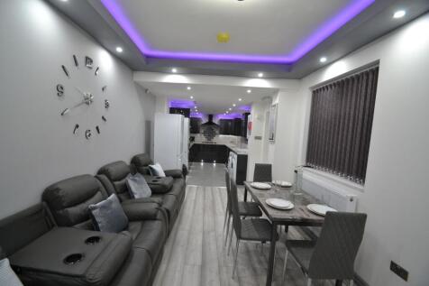 Modern, well-lit living room featuring a spacio...