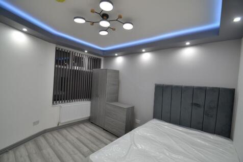 Modern and stylish bedroom featuring a large he...