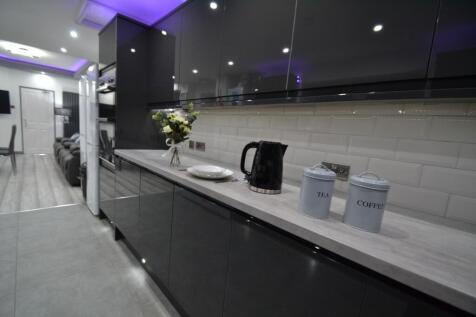 Modern and sleek kitchen equipped with a stylis...