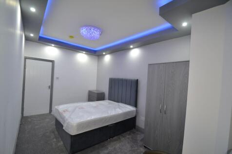 Modern master bedroom featuring a spacious layo...