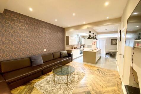 Contemporary open-plan living area with a long ...