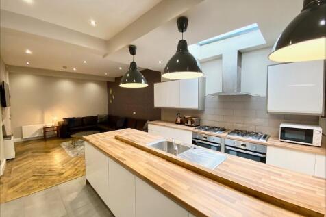 Bright open-plan living area with a modern fitt...