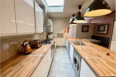 Bright modern galley kitchen with wooden-effect...