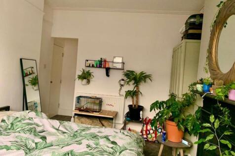 A bright and inviting bedroom filled with natur...