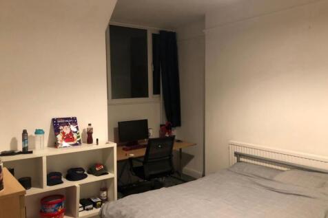 A cozy living room featuring a comfortable sofa...