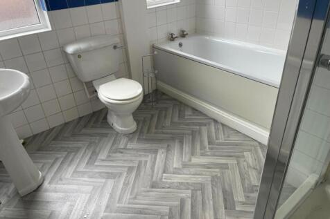 Clean and well-maintained bathroom with a batht...