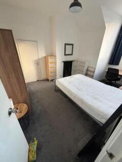A bright and welcoming double bedroom with a co...