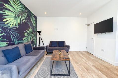 Bright contemporary living room with comfortabl...